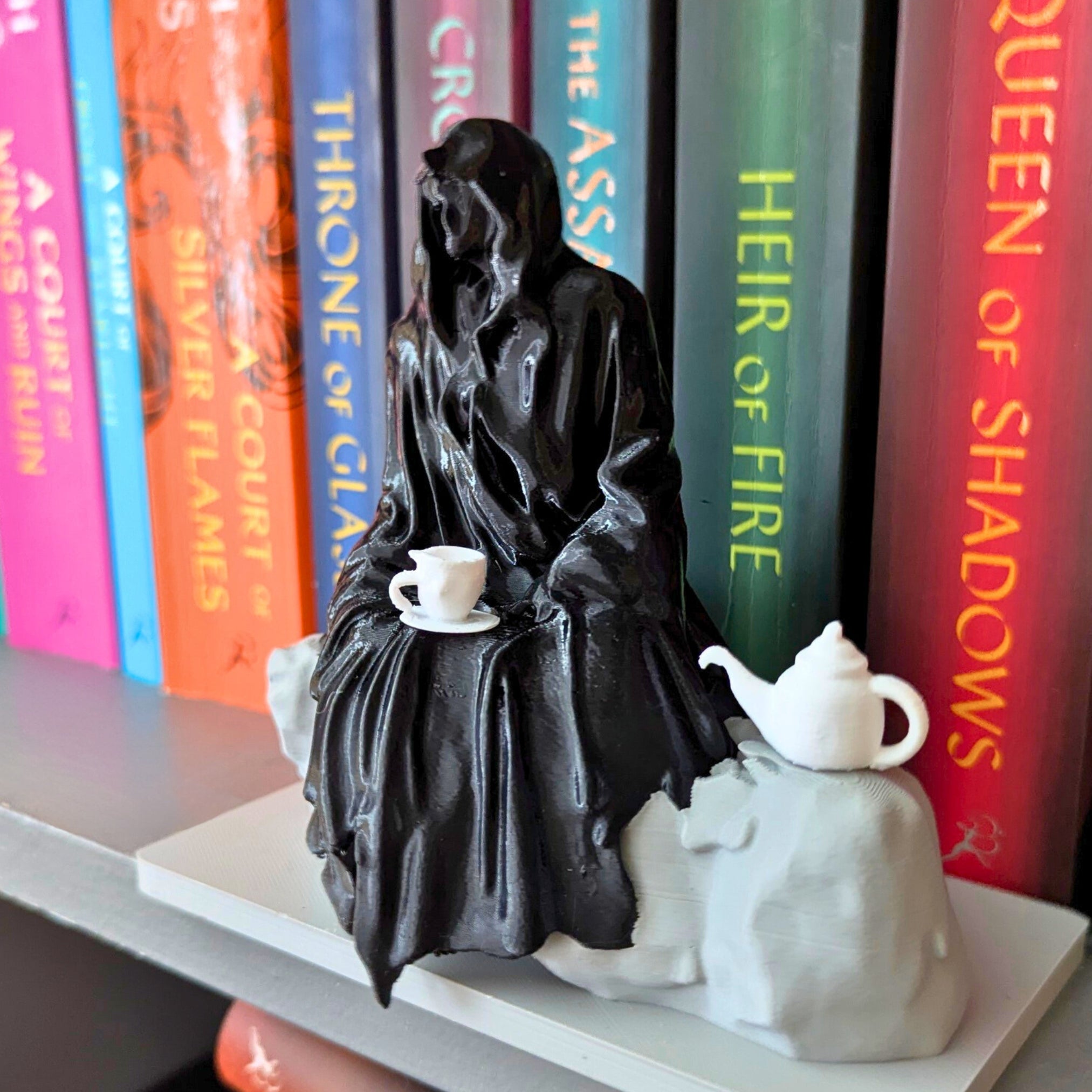 Spill the Tea Bookshelf Decor - Seated Hooded Ghost Figurine with Teacup and Tea