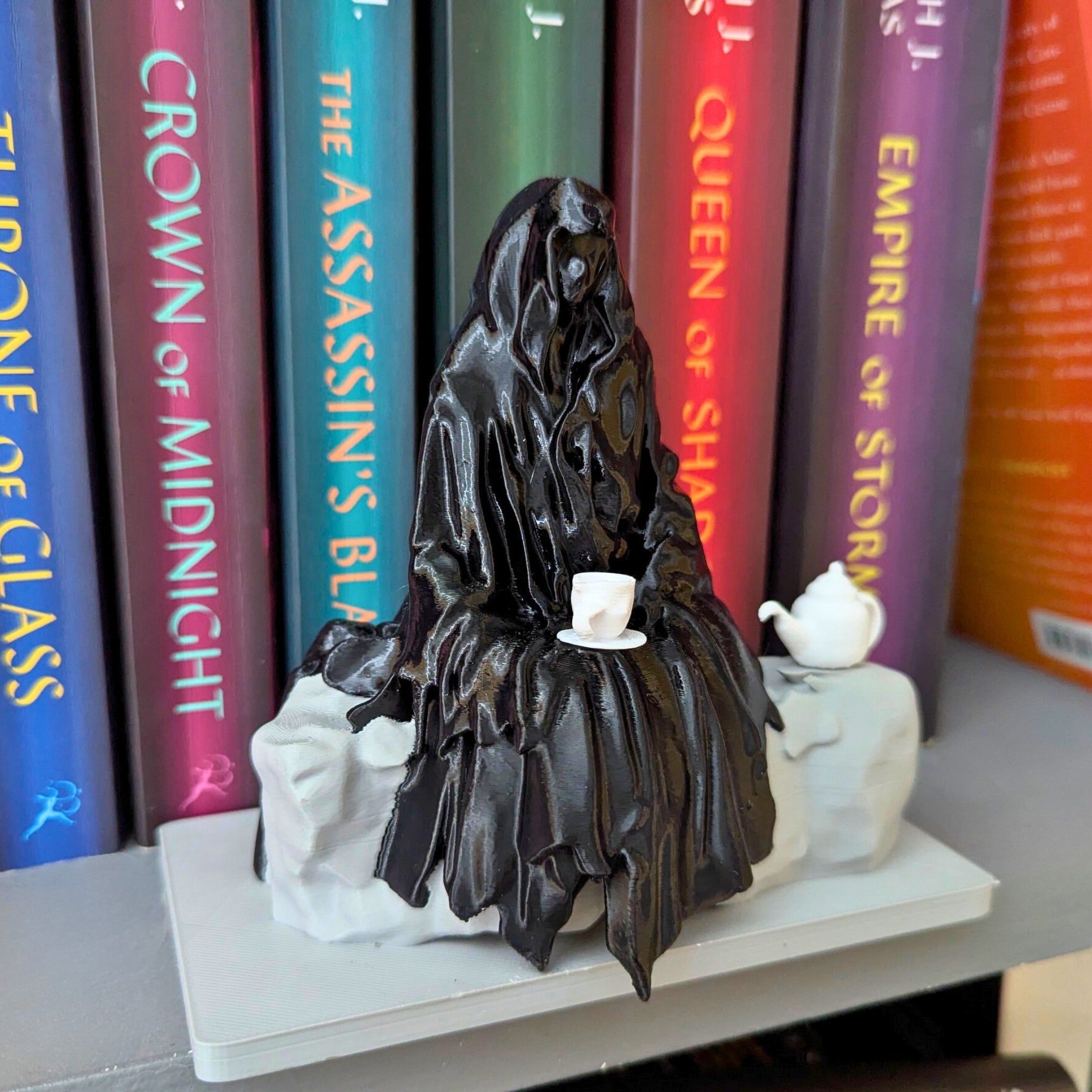 Spill the Tea Bookshelf Decor - Seated Hooded Ghost Figurine with Teacup and Tea