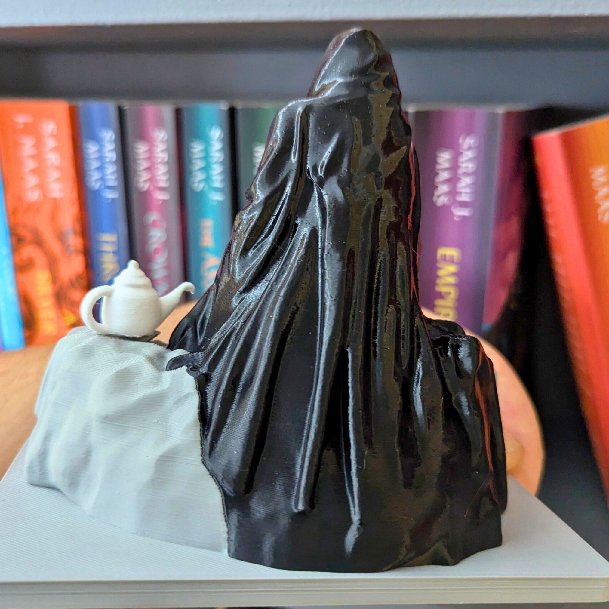 Spill the Tea Bookshelf Decor - Seated Hooded Ghost Figurine with Teacup and Tea